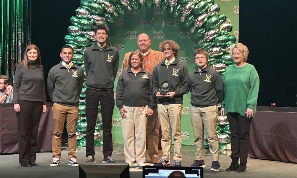 Huntington high school team holding first place trophy