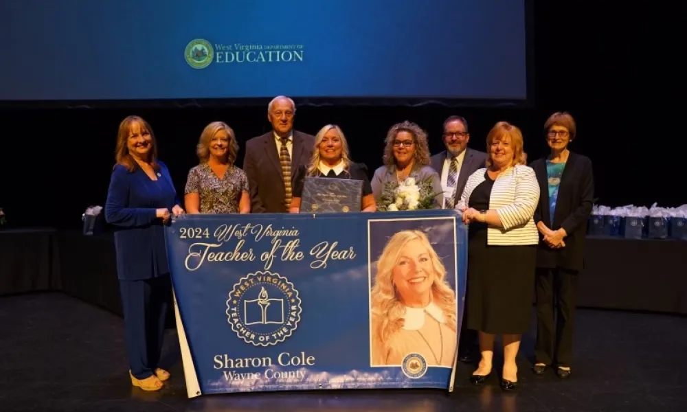 2024 Teacher of the Year Sharon Cole receiving her award