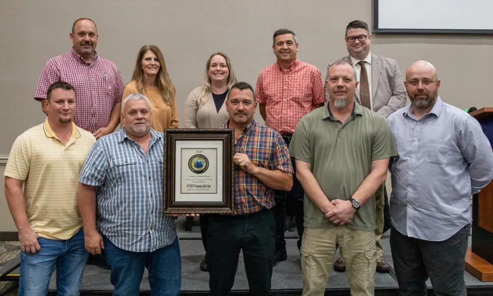 Huttonsville Correctional Facility staff accept the 2024 WVSDT Program of the Year award.