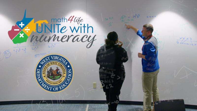 A man and a woman point at a whiteboard with the WVDE Unite With Numeracy Logo next to them.