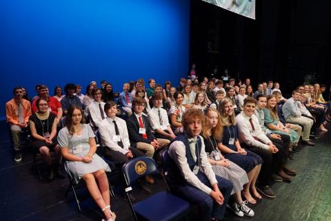 Group of Golden Horseshoe winners sit on the stage at the Knighting Ceremony