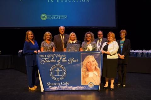 2024 Teacher of the Year Sharon Cole receiving her award