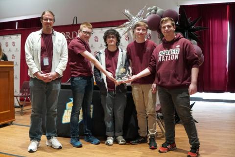 Bluefield High School students posing with a first-place trophy.